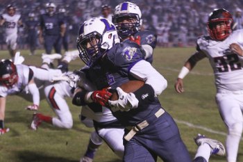 Lemoore's offense slowed down in Friday night's game against Hanford. The Bullpups won the coveted Milk Can Trophy for the first time in three years.